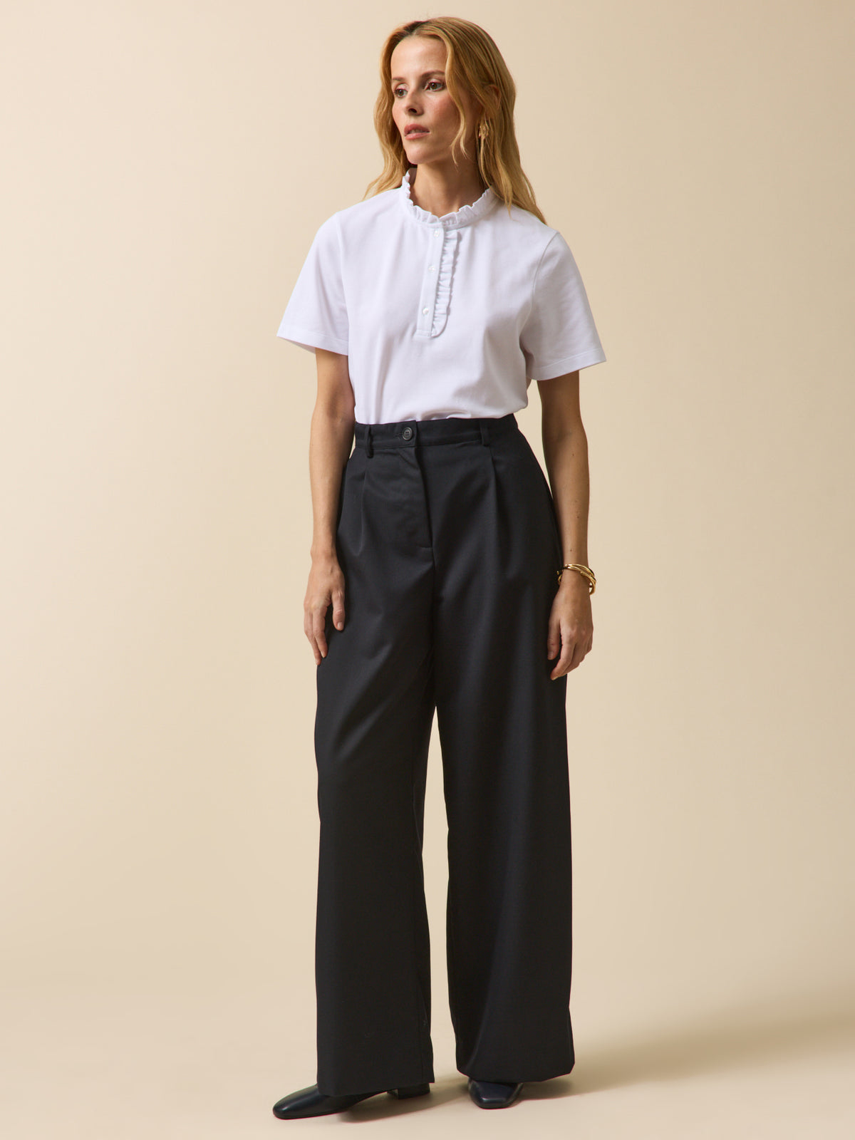 Polo maille piquée col volanté femme